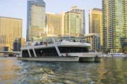 Luxury yacht at Dubai Marina with skyscrapers in the background