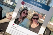 Family posing with an Instagram frame aboard a luxury Dubai yacht.