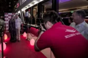 Guests posing for photos on the red carpet during a yacht boarding event