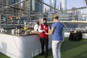 Guest being served refreshments on a luxury yacht