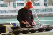 Chef preparing fresh meals onboard a luxury yacht in Dubai