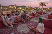 Guests relaxing in a traditional desert camp with hookah