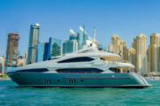 Sunseeker yacht cruising at Dubai Marina with skyline view