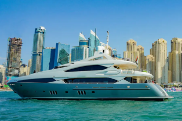 Sunseeker yacht cruising at Dubai Marina with skyline view