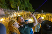 Group stargazing with a guide in the desert