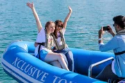 Two women posing for a photo on a speedboat in Dubai's waters