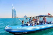 Speed boat with passengers enjoying a ride in front of Atlantis, The Palm.