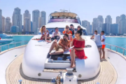 Group relaxing on a yacht deck with Dubai's skyline in the background