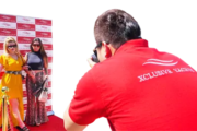 Photographer taking pictures of guests at a red carpet event for Xclusive Yachts.