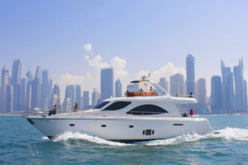 Luxurious yacht cruising in Dubai Marina with a stunning skyline backdrop