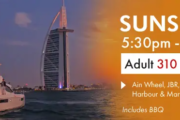 Luxury yacht with Burj Al Arab backdrop during sunset in Dubai