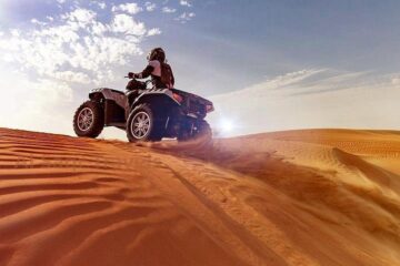 ATV trekking on desert dunes