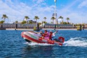 Couple cruising on a self-drive boat in Dubai Marina.