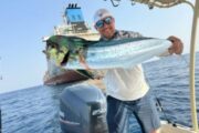 Fisherman with a Mahi-Mahi caught on a fishing excursion.