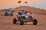 Dune buggy ride through the Dubai desert at sunset