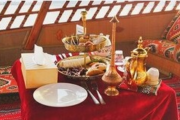 Luxurious Arabian-style dining setup on a dhow cruise