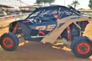 Can-Am Maverick RS dune buggy parked on the desert sand.