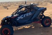 A CAN-AM Maverick XRS parked on a vast desert landscape.