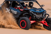 CAN-AM Maverick XRS kicking up sand while speeding through the desert.