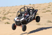 Group riding a powerful 4-seater Polaris dune buggy.