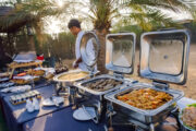 A luxurious breakfast buffet with hot dishes, pastries, and local specialties in the desert.