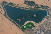 A stunning aerial view of a man-made lake shaped like 