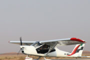 Light Sport Aircraft A6 MEC flying high in the sky.