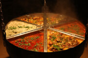 A steaming traditional Arabian dish with rice and stew.