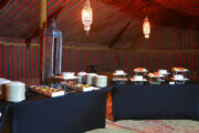 Traditional dining setup in a luxury Arabian tent.