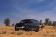 Luxury black Land Rover in the Dubai desert