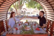 Couple enjoying a gourmet breakfast in the Dubai desert