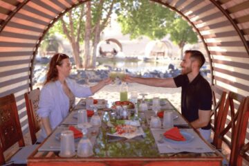 Couple enjoying a gourmet breakfast in the Dubai desert