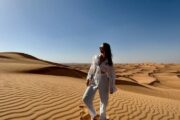 Tourist exploring the Dubai desert during sunrise