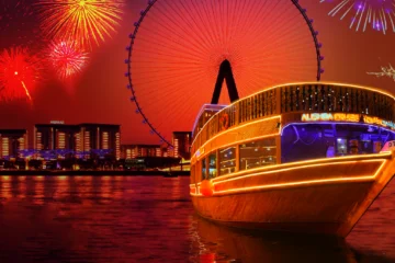 Dubai Water Canal cruise at night with city lights.