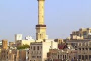 Traditional Abra boat crossing Dubai Creek in historic Al Fahidi district