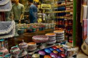 Colorful traditional pottery and souvenirs on display in a Dubai souk shop