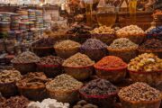Colorful spices and traditional ceramic plates at Dubai Spice Souk