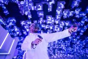 Gamer wearing VR headset and controllers at Pixoul Gaming Abu Dhabi