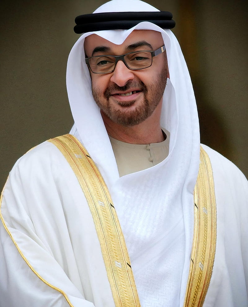 Sheikh Mohammed bin Zayed Al Nahyan in traditional attire smiling.