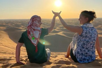 Share the magic of sunrise with someone special amidst endless dunes.