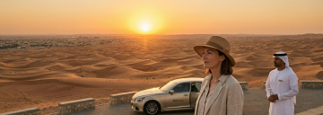 luxury car in Al Ain desert at sunset with traveler and chauffeur UAE dunes