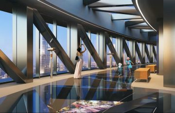 couple walking down staircase Sky Views Observatory Dubai interior experience