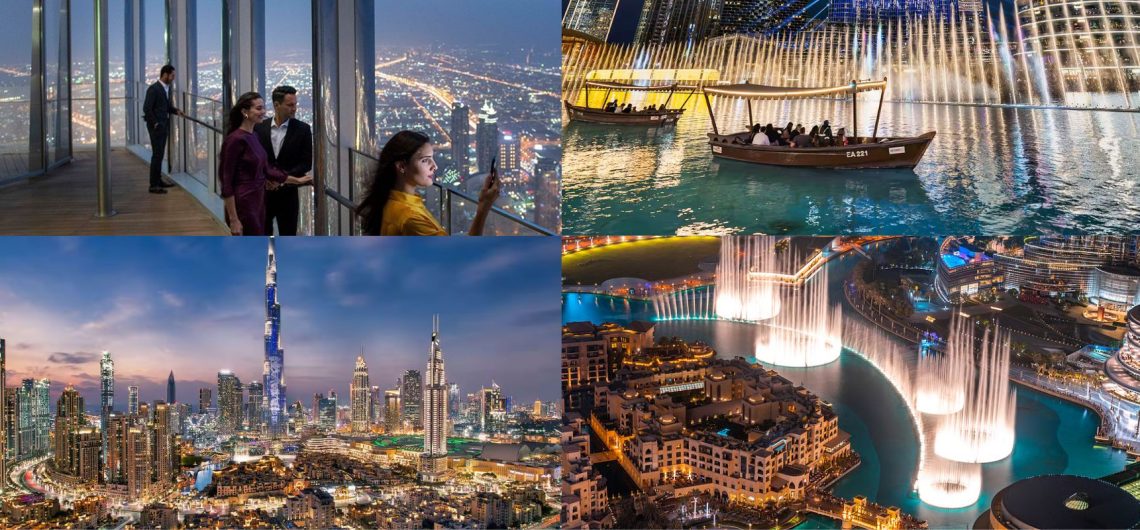 visitors enjoying Burj Khalifa observation deck at night with city lights