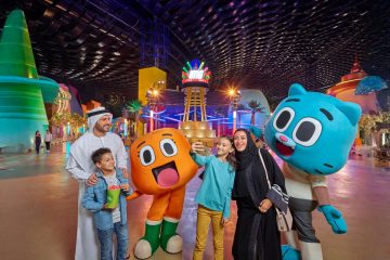family taking selfie with cartoon characters at IMG Worlds Dubai