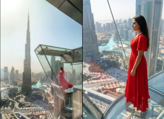 woman in red dress on glass slide Sky Views Dubai Burj Khalifa background city view