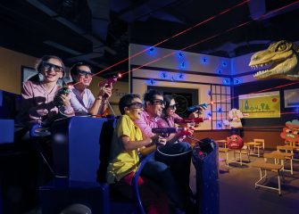 family playing laser shooting ride inside indoor theme park Dubai