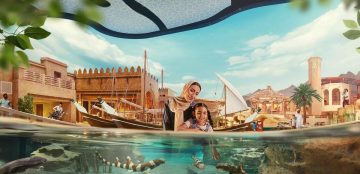 family exploring marine habitat with fish at SeaWorld Abu Dhabi