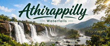 Panoramic view of Athirappilly Waterfalls cascading through lush forests in Kerala.