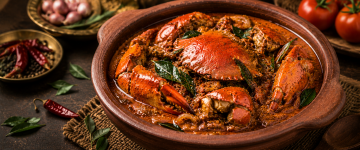 Kerala-style Njandu Curry featuring fresh crab cooked in spicy coconut gravy.