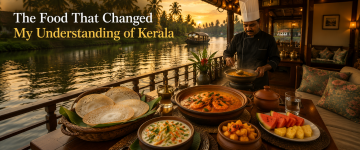 Traditional Kerala seafood meal freshly prepared by a chef aboard a luxury houseboat.